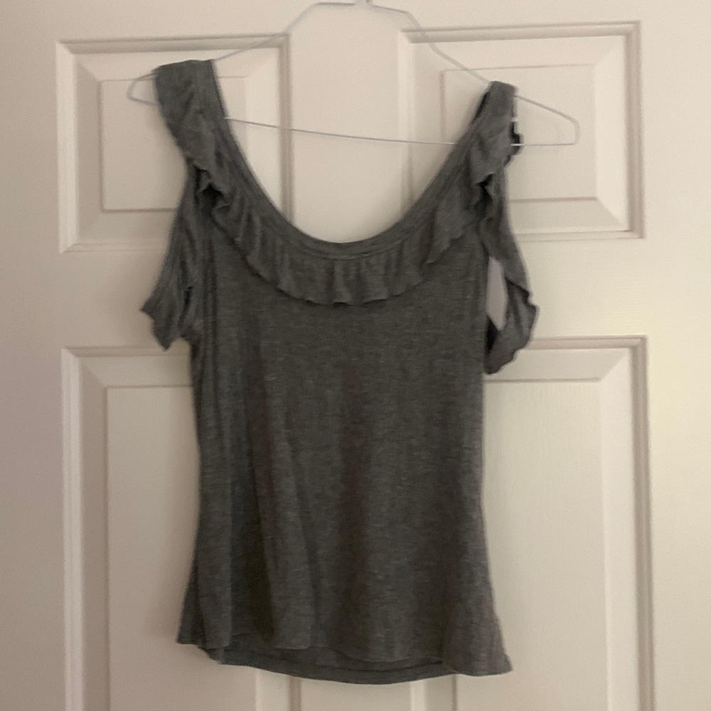 Gray shirt with fro ruffle on shoulder